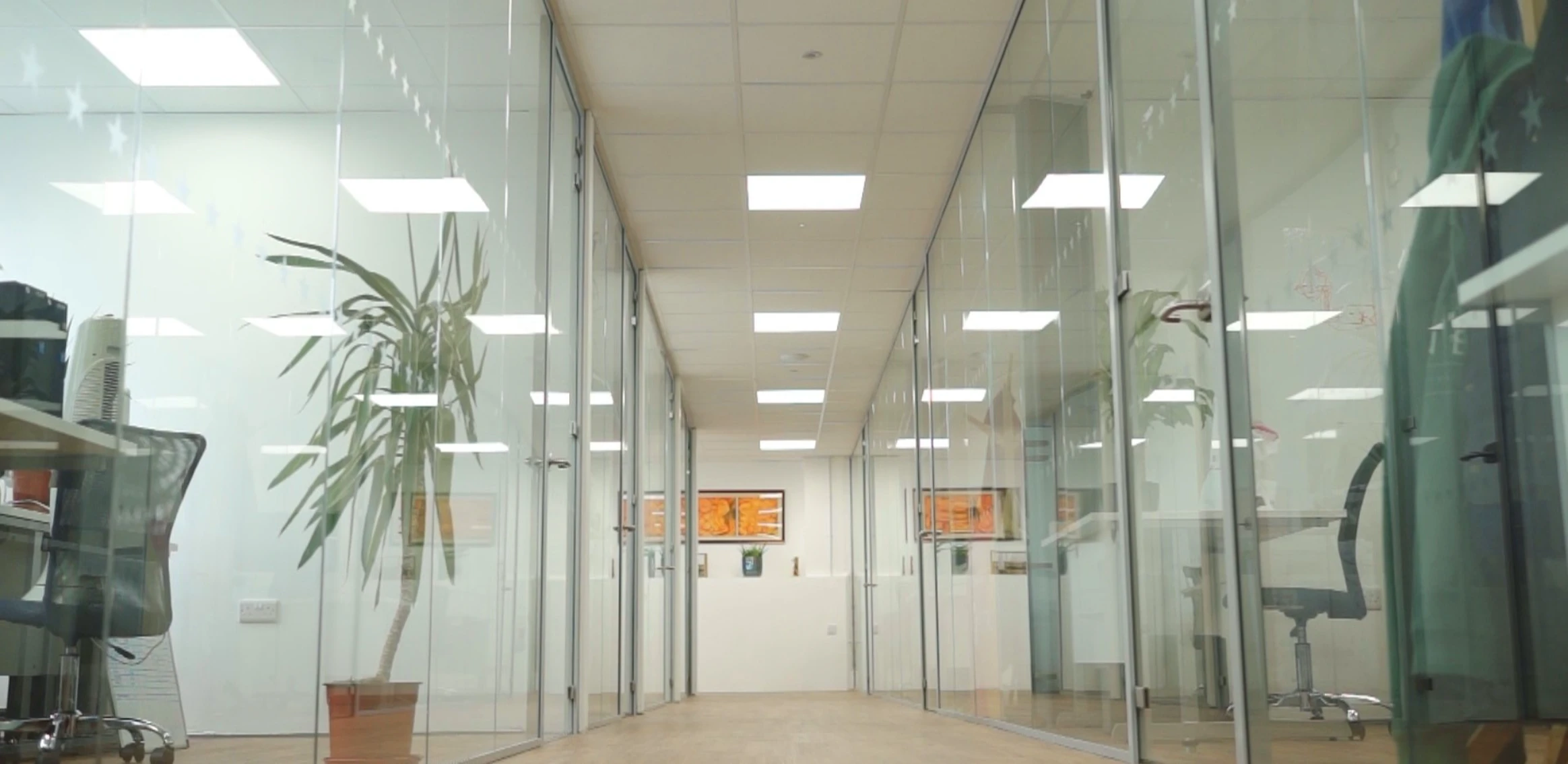 Laptop on desk in hybrid home working setup.