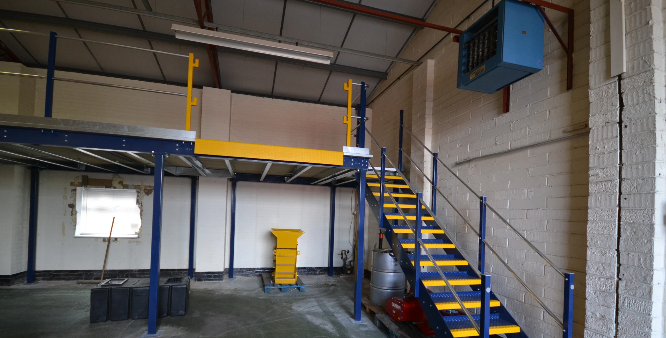 black stairs leading up to mezzanine flooring level.