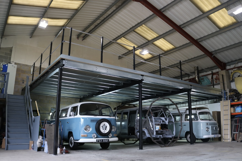 Warehouse mezzanine | Mezzanine floor above VW campervans.