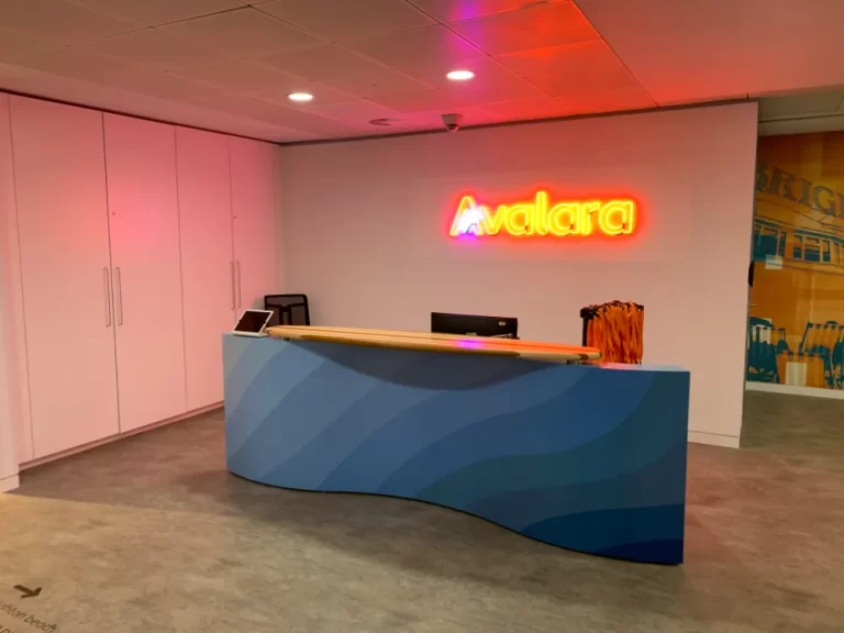 Avalara - reception area with logo on wall.