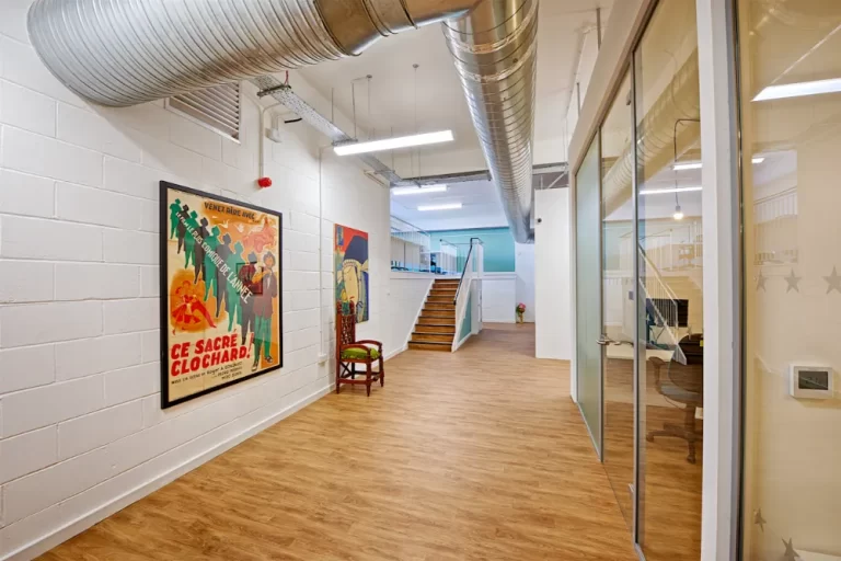 Freedom Works - Modern hallway with glass partitions