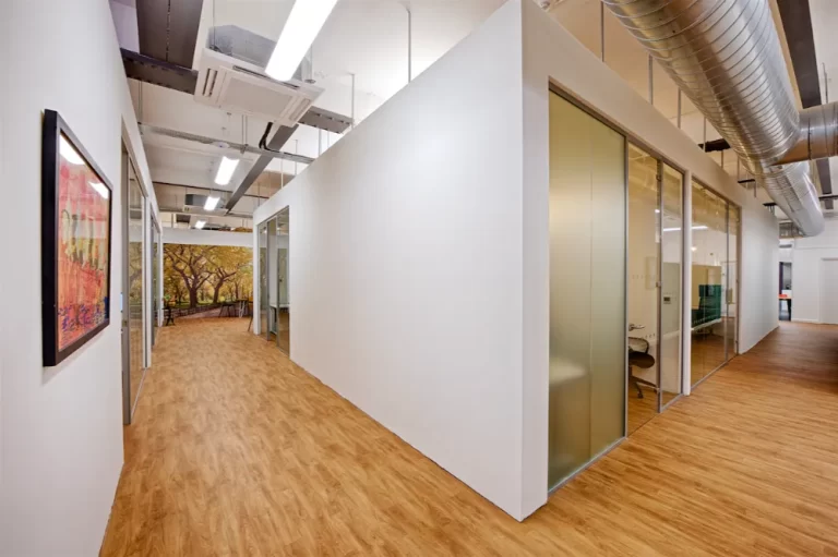 Freedom Works - Modern hallway with glass partitions