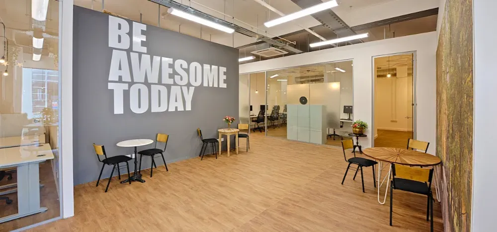 Freedom Works - Modern hallway with glass partitions.