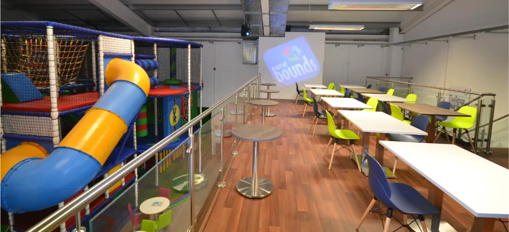 Out of Bounds | Mezzanine floor level for seating with a glass rail.