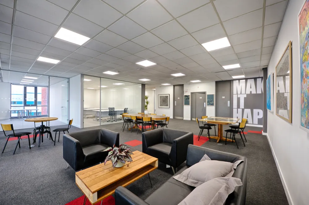 office design trends | Modern office space with chairs and a social space.