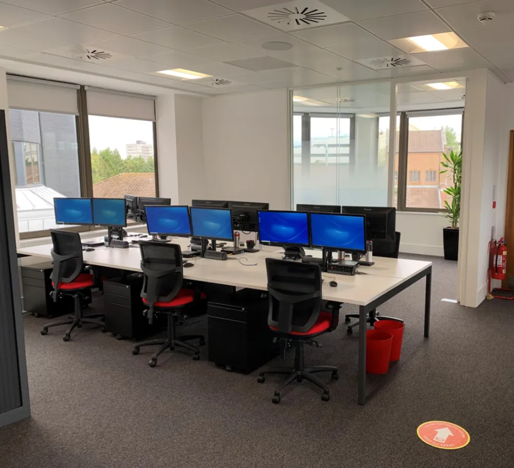 Office design | Modern office space with desks and computer screens