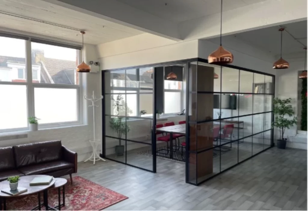 Modern boardroom with glass partitions.