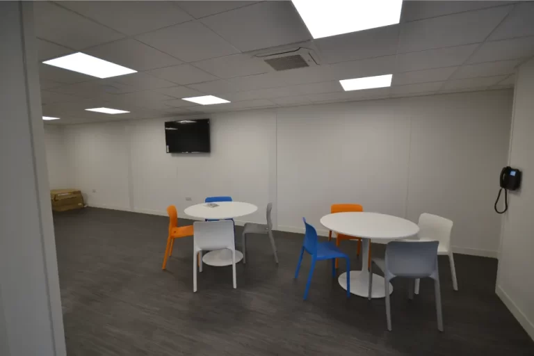 Pragma | Break area with tables and chairs.